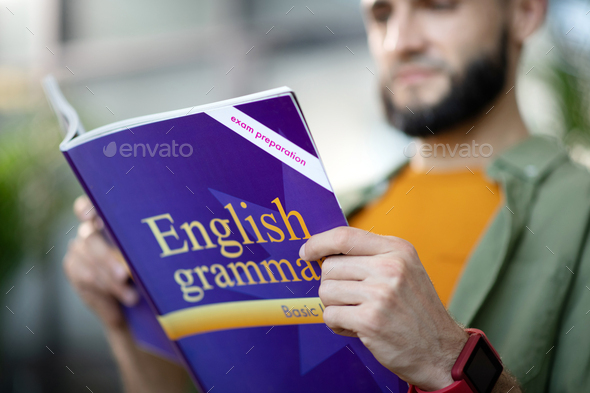 Man preparing for exam and repeating English grammar