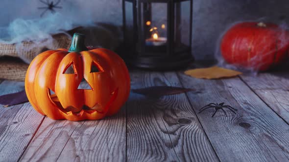 Close Up of Jack-o-lanterns on Scary Dark Blue Windy Background alt