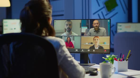 Back View of Business Woman Talking About Sale Report in Video Conference alt