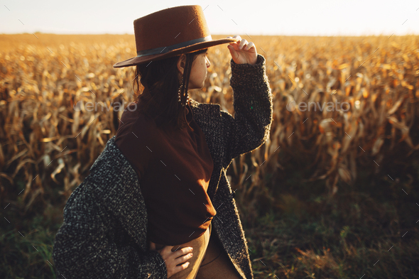 Young Beautiful Hipster Woman Standing On Field In The Countrysi