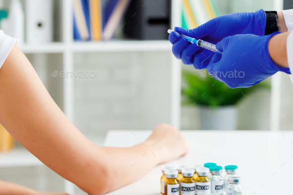 Doctor\'s hands preparing to make an injection