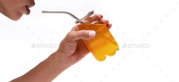 Woman Drink Carbonated Citrus Beverage with Reusable Metal Straw. Female Hand Hold Soda Can.