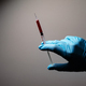 Doctor&#39;s hand with blood probe. Coronavirus test - PhotoDune Item for Sale