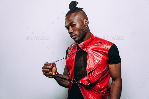 handsome man wearing red leather jacket portrait. Futuristic cyberpunk fashion style