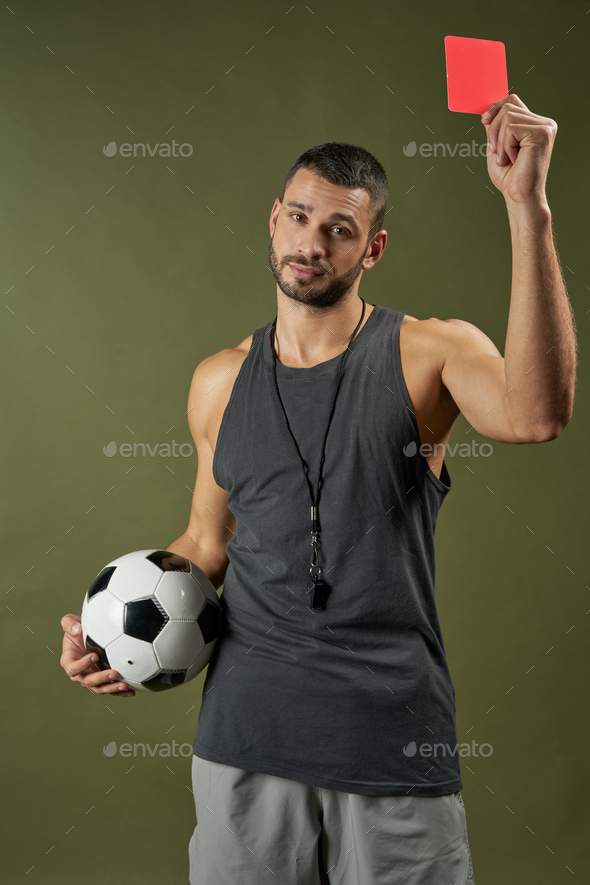 Handsome adorable football referee training football player in sport center