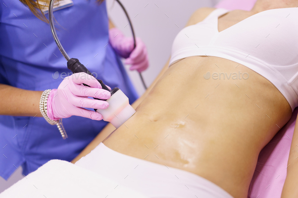 Woman receiving anti-cellulite treatment with radiofrequency