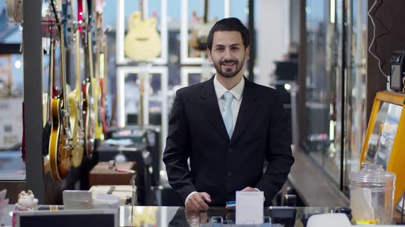 Portrait video young smart businessman at modern musical instrument store