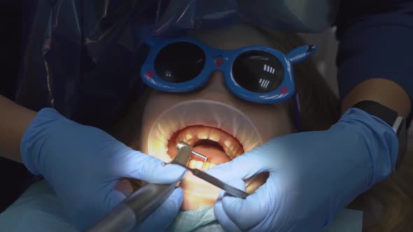 Little Girl with Oral Dilator at Dentist's Appointment alt