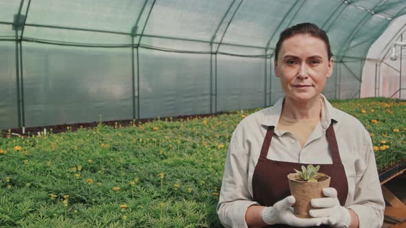 Female Gardener with Potted Plant alt