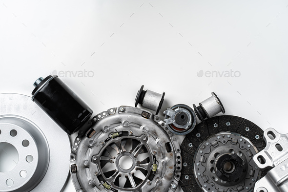 New metal auto parts on grey background