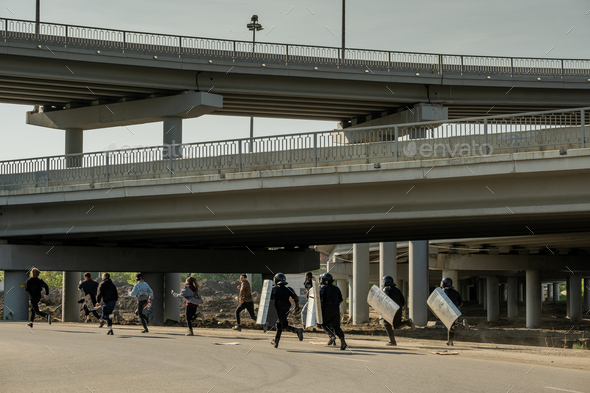 Riot police running for law-breakers Stock Photo by Pressmaster | PhotoDune