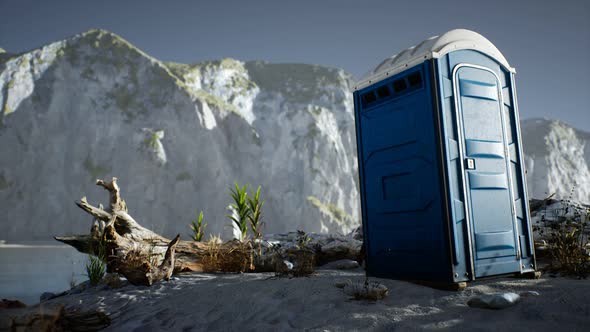 Portable Mobile Toilet in the Beach. Chemical WC Cabin alt