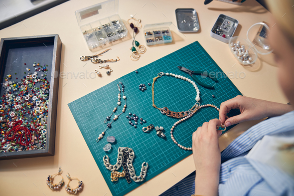 Creation of trendy jewel goods in a studio