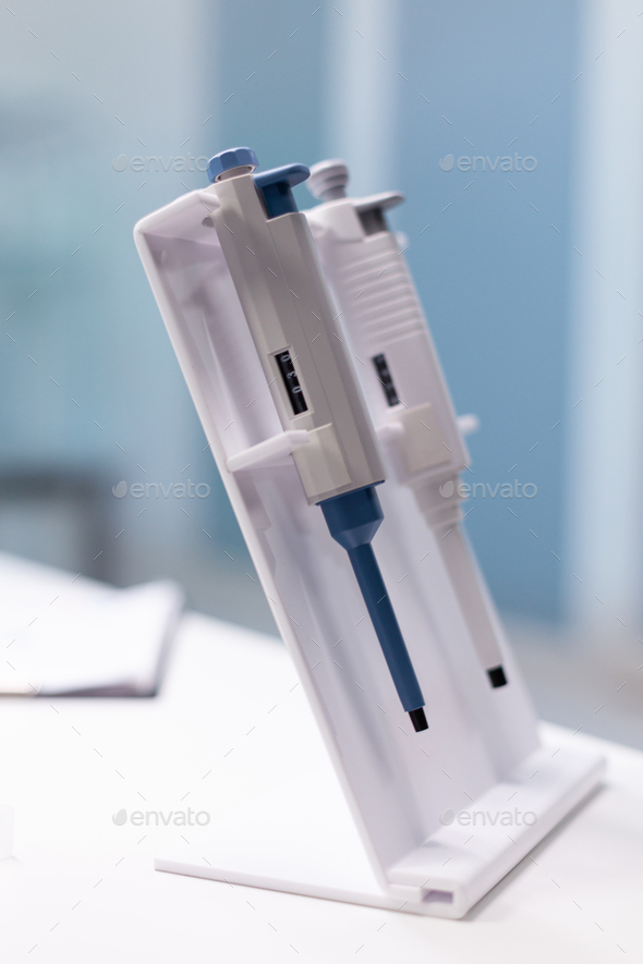 Medical micropipette standing on table ready for microbiology scientific test experiment Stock