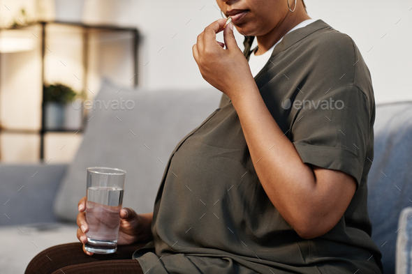 Pregnant Woman Taking Vitamins