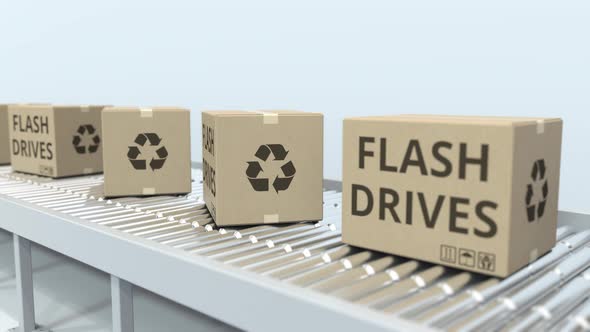 Cartons with Flash Drives on Roller Conveyor alt