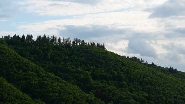 Vibrant time lapse of a lush hillside in the moselle region. Static wide angle view alt