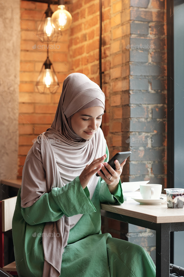 Muslim Woman Connecting to WIFI