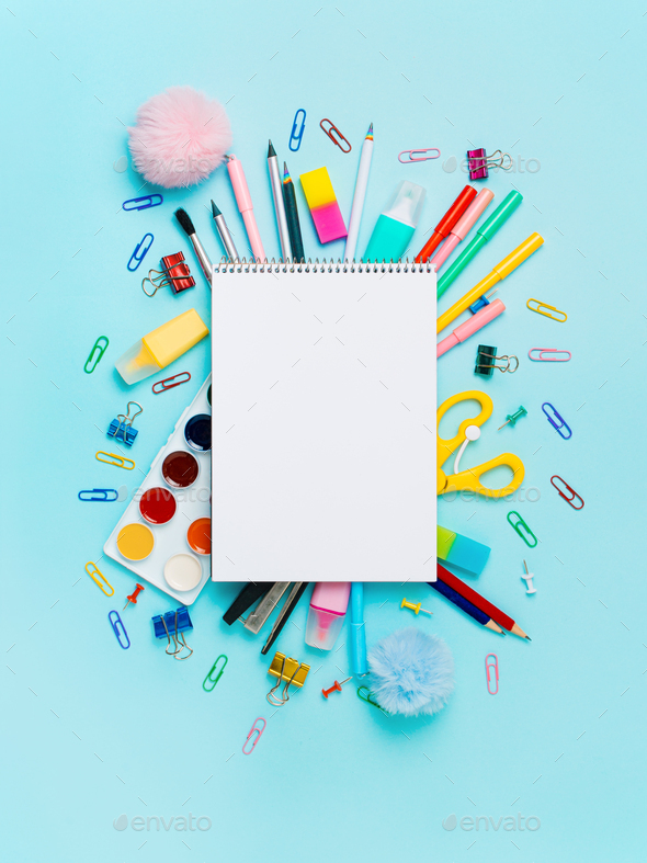 School supplies and empty notebook on blue bckg - Stock Photo - Images