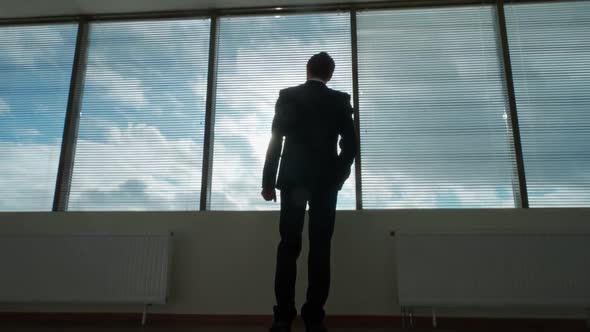 Business Motivation Young Businessman Stands in Front of a Panoramic Window Morning in a Modern alt