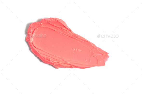 Pink lipstick smudge on white background. Mat lipstick texture