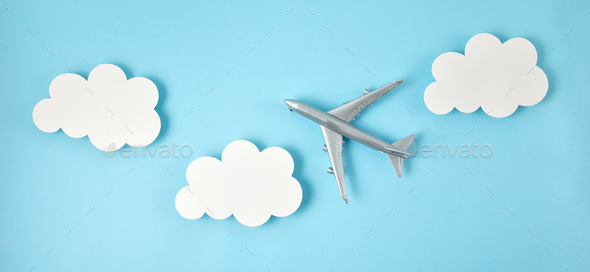 Banner of miniature airplane. Travel tourism, airlines, low cost flights concept. Top view, flat lay