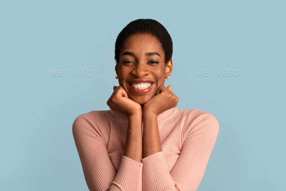 Good News. Portrait Of Cheerful Excited Black Woman Touching Face With Joy
