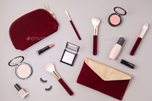 Flat lay of female fashion accessories, makeup products and