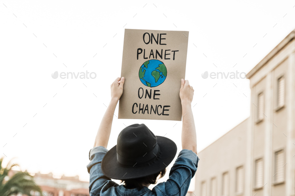 Demonstrator on the city protesting against climate change - Global warming and environment concept - Stock Photo - Images