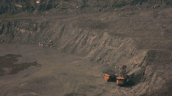 Iron ore mining in an open pit top view.