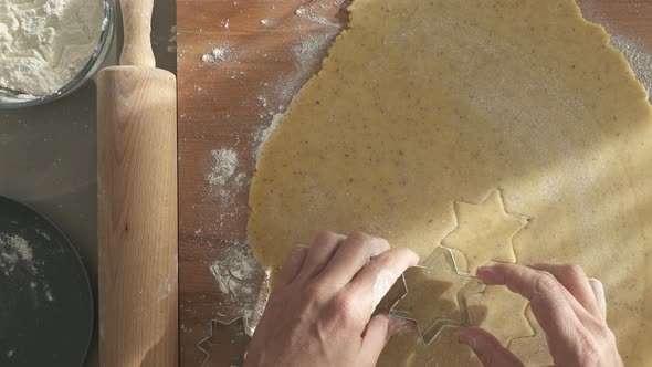 Top View Closeup Cutting Out Cookies for Christmas alt
