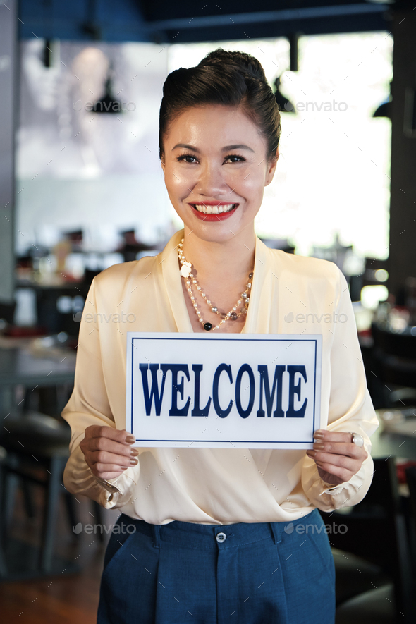 Restaurant Owner holding Sign Stock Photo by DragonImages