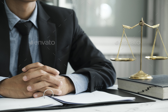 Male lawyer in the office with brass scale. Stock Photo by ijeab | PhotoDune