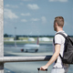 Traveler watching airplanes at airport - PhotoDune Item for Sale