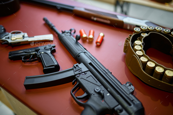 Automatic rifle and pistols in gun store closeup - Stock Photo - Images