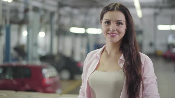 Young Beautiful Caucasian Woman Looking at Camera and Smiling alt