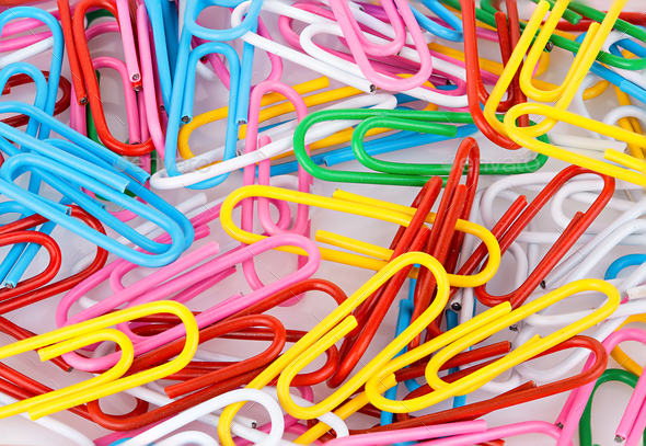 Stationery paper clips, multicolored close-up as a background. Stationery concept. - Stock Photo - Images