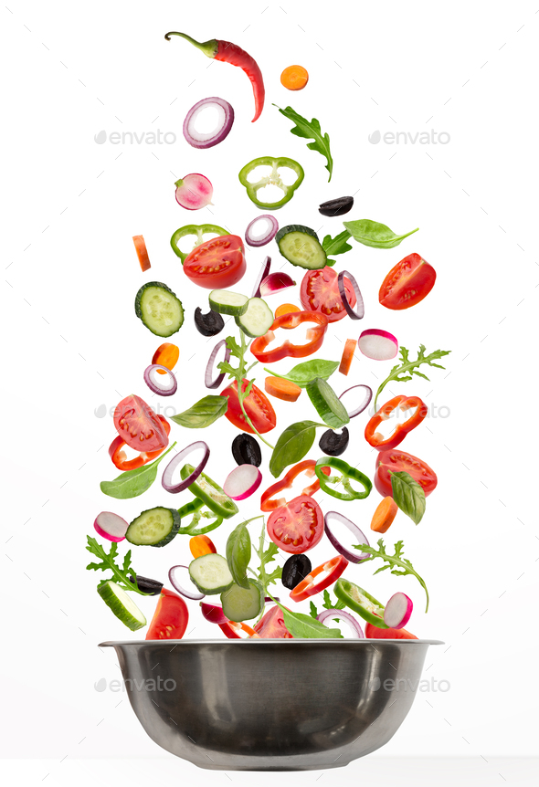 Fresh vegetables flying into cooking pot, isolated on white background - Stock Photo - Images