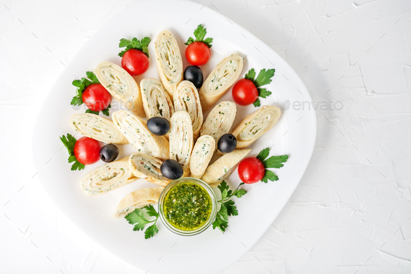 Pancake with feta cheese and herbs on a white background. Top vi