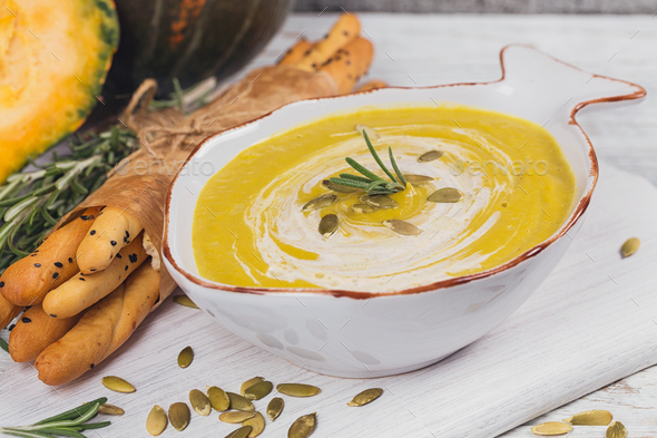 Pumpkin soup with cream and pumpkin seeds - Stock Photo - Images