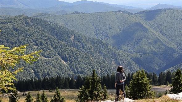 Girl Watching The Mountains