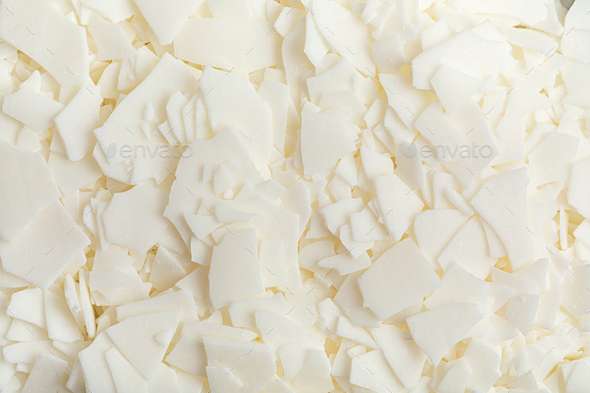 Flatlay with organic white soy wax flakes. Handmade candles, diy, hobby  idea Stock Photo by OksaLy