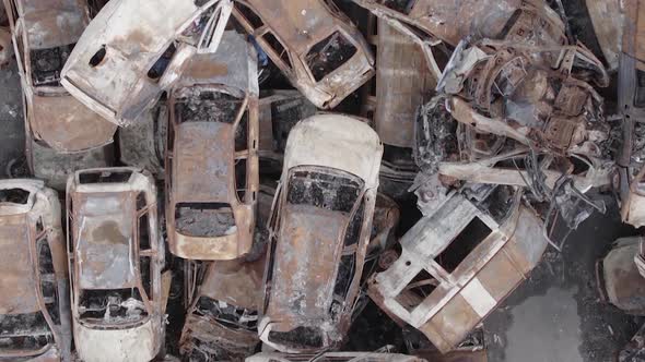 Vertical Video Irpin Ukraine  Burnt and Destroyed Cars alt