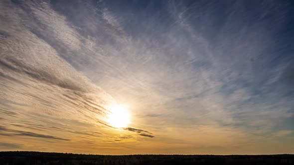 Beautiful Evening Sunset, Time Lapse, Movement of Clouds of a Different Level Against the Setting alt