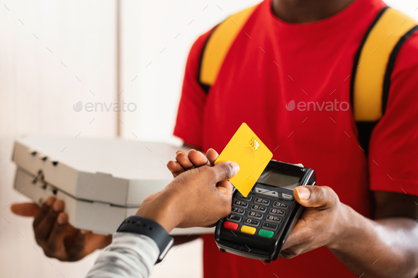 Unrecognizable Customer Paying Courier Putting Credit Card To Terminal Indoors - Stock Photo - Images
