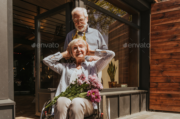Senior couple, husband takes care of invalid wife
