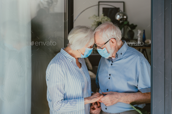 Elderly couple at home during covid-19 pandemic quarantine - Stock Photo - Images