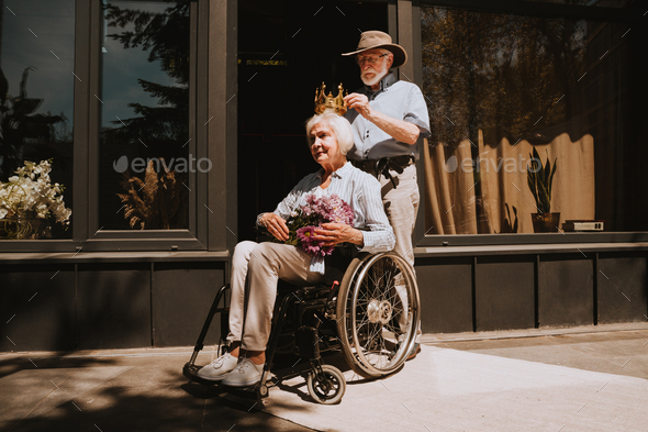 Senior couple, husband takes care of invalid wife