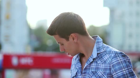 Man Talking Over Phone Smiling Enjoying Call Conversation, City alt