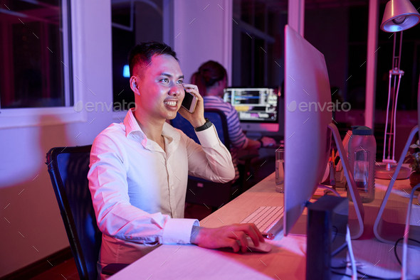 Software Developer Answering Phone Call - Stock Photo - Images